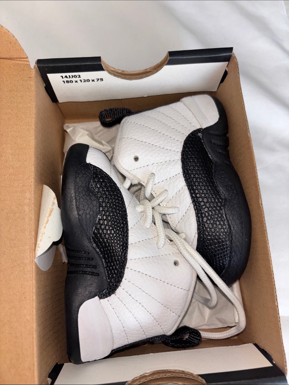 Jordan Kids' 12 Black and White Sneakers
